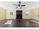 Large living room with hardwood floors, fireplace, ceiling fan and lots of light at 305 Plantation Dr, Kings Mountain, NC 28086