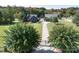 Aerial view of estate with manicured lawns, gated entrance, and buildings at 3099 Trinity Church Rd, Concord, NC 28027