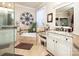 Bright bathroom featuring a soaking tub, double sink vanity, and glass enclosed shower at 3099 Trinity Church Rd, Concord, NC 28027