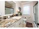Well-lit bathroom featuring a granite countertop, white cabinets, and a glass-enclosed shower for a modern touch at 3099 Trinity Church Rd, Concord, NC 28027