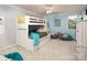 Light and airy bedroom featuring a bunk bed, ceiling fan, and bean bag chairs at 3099 Trinity Church Rd, Concord, NC 28027