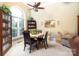 Bright dining room with large windows, a charming table set, a ceiling fan and display cabinets at 3099 Trinity Church Rd, Concord, NC 28027