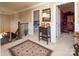 Hallway featuring decorative trim, wood railing stairs, and an elegant foyer rug at 3099 Trinity Church Rd, Concord, NC 28027