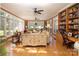 Bright living room with a built in bookcase, hardwood flooring, a desk and lots of natural light at 3099 Trinity Church Rd, Concord, NC 28027