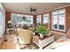 Sun-filled living room with stylish furniture, hardwood floors and large windows overlooking the yard at 3099 Trinity Church Rd, Concord, NC 28027