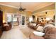 Comfortable living room with neutral colors, cozy couches, ceiling fan and a view of the backyard at 3099 Trinity Church Rd, Concord, NC 28027