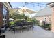Charming outdoor patio with elegant dining furniture and lighting, perfect for entertaining or relaxing outdoors at 3099 Trinity Church Rd, Concord, NC 28027