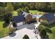 Back aerial view of the brick home with a pool, detached garage, spacious driveway and basketball hoop at 3099 Trinity Church Rd, Concord, NC 28027