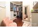 Spacious walk-in closet with custom shelving, hanging racks, and decorative mirror at 3099 Trinity Church Rd, Concord, NC 28027