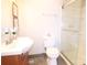 Bright bathroom featuring a vanity, toilet, and glass-enclosed shower at 313 Nassau Pl, Gastonia, NC 28052