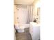 Bright bathroom boasts a shower-tub combo, vanity, and neutral finishes at 313 Nassau Pl, Gastonia, NC 28052