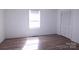Inviting bedroom with new floors, closet, and window, creating a comfortable space at 313 Nassau Pl, Gastonia, NC 28052