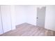 Bedroom with new floors, closet, and door, creating a fresh and inviting atmosphere at 313 Nassau Pl, Gastonia, NC 28052