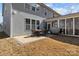 Inviting backyard patio with an outdoor dining set and grill, perfect for outdoor entertaining at 3212 Burnello Ct, Iron Station, NC 28080