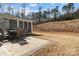 Backyard patio with an outdoor dining set and grill, perfect for enjoying meals and outdoor gatherings at 3212 Burnello Ct, Iron Station, NC 28080