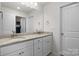 Bathroom features dual sinks, granite counters, white cabinets and lots of natural light at 3212 Burnello Ct, Iron Station, NC 28080