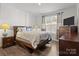 Comfortable bedroom features wood floors, neutral paint and great natural light at 3212 Burnello Ct, Iron Station, NC 28080