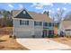 Well-maintained two-story house with two-car garage and manicured landscaping at 3212 Burnello Ct, Iron Station, NC 28080