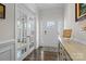 Bright foyer with hardwood floors and elegant wainscoting at 3212 Burnello Ct, Iron Station, NC 28080