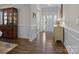 Welcoming foyer with hardwood floors and beautiful moldings at 3212 Burnello Ct, Iron Station, NC 28080