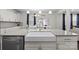 Well-appointed kitchen with a farmhouse sink, stainless steel dishwasher, and granite countertops at 3212 Burnello Ct, Iron Station, NC 28080