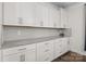 Clean, white kitchen with stainless steel hardware and plenty of countertop space at 3212 Burnello Ct, Iron Station, NC 28080