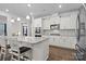 Stylish kitchen with stainless steel appliances and granite countertops, adjacent to breakfast area at 3212 Burnello Ct, Iron Station, NC 28080