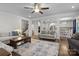 Spacious living room showcasing an open floor plan, hardwood floors, and comfortable seating at 3212 Burnello Ct, Iron Station, NC 28080