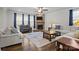 Cozy living room features a stone fireplace, hardwood floors, and ample seating at 3212 Burnello Ct, Iron Station, NC 28080