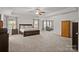 Bright main bedroom boasts a trey ceiling, large windows, and an attached seating area offering comfort and style at 3212 Burnello Ct, Iron Station, NC 28080