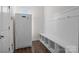 Convenient mud room features cubbies for storage and a full size refrigerator at 3212 Burnello Ct, Iron Station, NC 28080