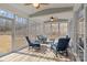 Bright sunroom with floor-to-ceiling windows and wood-look flooring for relaxing at 3212 Burnello Ct, Iron Station, NC 28080
