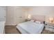 A bedroom with a light color scheme and matching bedside tables at 3400 Thistle Bloom Ct, Charlotte, NC 28269