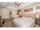 Spacious primary bedroom featuring a tray ceiling and neutral color scheme that adjoins the primary bathroom at 3400 Thistle Bloom Ct, Charlotte, NC 28269