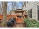 Inviting outdoor deck with lounge seating, complemented by a gazebo and a serene backyard view for relaxation at 3400 Thistle Bloom Ct, Charlotte, NC 28269
