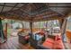 Inviting outdoor deck with lounge seating, complemented by a gazebo, grill, and dining table for entertaining at 3400 Thistle Bloom Ct, Charlotte, NC 28269