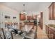 Eat-in kitchen with dark wood cabinets, stainless steel appliances and french doors at 3400 Thistle Bloom Ct, Charlotte, NC 28269
