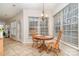 Inviting breakfast nook with tile flooring, a round table, and a large window overlooking the outdoor scenery at 3612 Brookstone Trl, Indian Trail, NC 28079