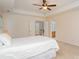 Bright main bedroom with neutral walls, carpet flooring, and access to an ensuite bathroom and additional living spaces at 3612 Brookstone Trl, Indian Trail, NC 28079