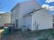 The backyard has a small deck, siding, and central air conditioning at 3813 Brookchase Ln, Charlotte, NC 28205