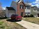 A two-story home showcasing a well-maintained front lawn and a car parked in the driveway at 3813 Brookchase Ln, Charlotte, NC 28205