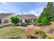 Well-maintained backyard featuring a patio, lawn, and manicured landscaping at 4001 Perth Rd, Fort Mill, SC 29707