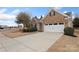 Brick home with a two-car garage and a spacious concrete driveway at 4001 Perth Rd, Fort Mill, SC 29707