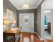 Elegant foyer featuring hardwood floors, decorative lighting, and a view of the front door at 4001 Perth Rd, Fort Mill, SC 29707