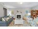Bright living room featuring a fireplace, comfortable seating, and elegant decor at 4001 Perth Rd, Fort Mill, SC 29707