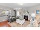 Inviting living room with a cozy fireplace, stylish furnishings, and beautiful hardwood floors at 4001 Perth Rd, Fort Mill, SC 29707