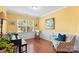 Bright sitting room with a piano, chair, and yellow painted walls at 4001 Perth Rd, Fort Mill, SC 29707