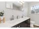 Bright bathroom featuring a double sink vanity with modern fixtures and a large mirror at 4083 Hord Rd, Sharon, SC 29742