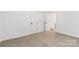 Bedroom with neutral carpet, white walls, and doors, offers ample closet space at 4083 Hord Rd, Sharon, SC 29742