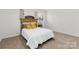 Bedroom with neutral walls and carpet, natural light, and a decorative rustic headboard at 4083 Hord Rd, Sharon, SC 29742